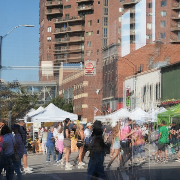 People browsing stalls at a local outdoor market