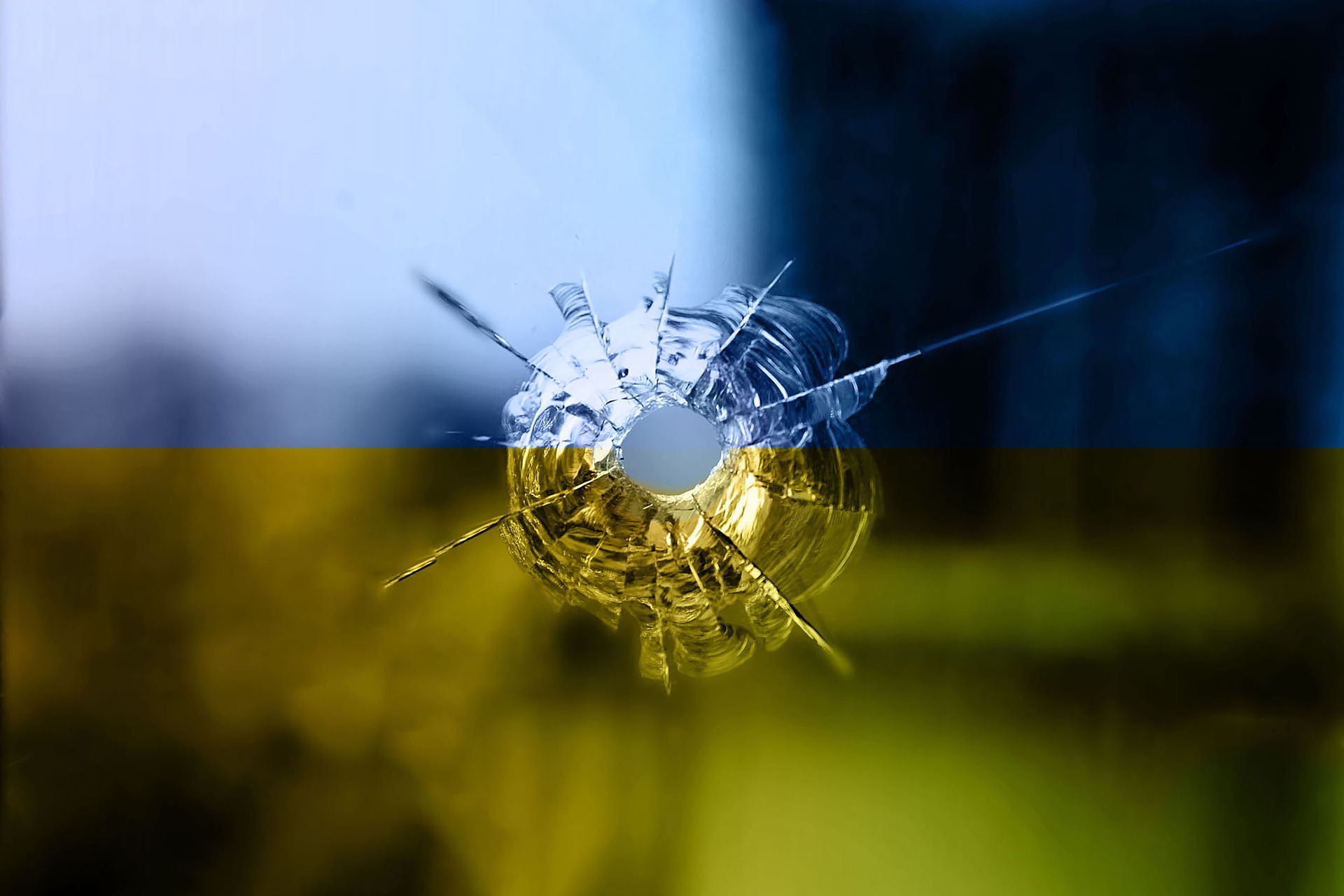 Royalty free image from https://pixabay.com/photos/bullet-hole-ukraine-flag-7075401/